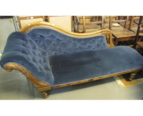 Victorian upholstered button back chaise longue with carved decoration on turned supports. (B.P. 24% incl. VAT) 