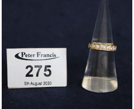 An 18ct gold half eternity style diamond set ring. 3.3g approx. (B.P. 24% incl. VAT)Diamonds are small/tiny, little more than