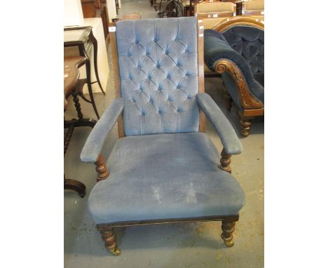 Late Victorian mahogany framed upholstered button back open armchair on turned supports and casters. (B.P. 24% incl. VAT) 