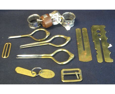 Small box of metalware to include; three pairs of brass dividers, two brass buckles, two military brass button polishing shro