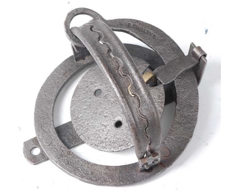 * An early 20th century pole trap, having 4 1/2" domed serrated jaws, the spring neck stamped E. Tinsley &amp; Co.Condition r