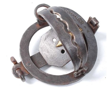 * A Victorian pole trap, having 4" serrated jaws and diamond shaped brass tongue, stamped J. Marshall with lion symbol and **