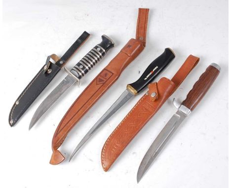 * A German hunting knife, the 12cm blade marked Solingen made in Germany, having a white metal banded handle, housed in a bla