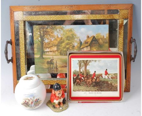 * An oak framed twin handled drinks tray, the mirrored centre transfer decorated with a village scene and huntsmen, w.55cm, t
