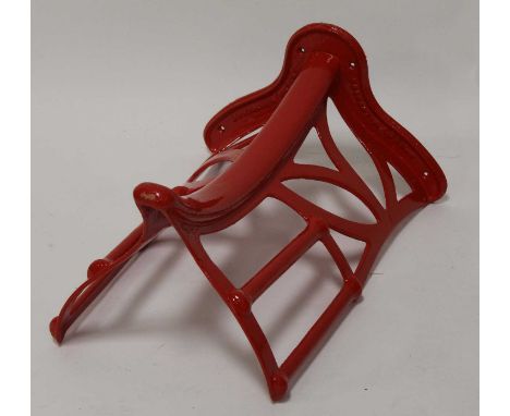 * A 19th century and later red painted iron saddle rack, stamped Musgraves Patent, Belfast &amp; London, 54cmCondition report