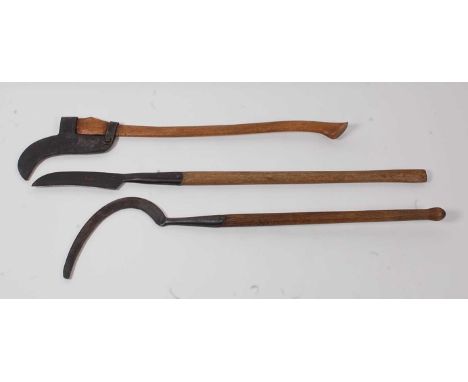 * An early model bush brush axe, the blade stamped The Collins Company Made In USA, 98cm, together with a long handled slashe