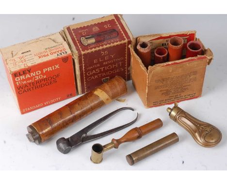 * A small collection of shooting tools and accessories to include an early 20th century combination shot/powder measure, a br