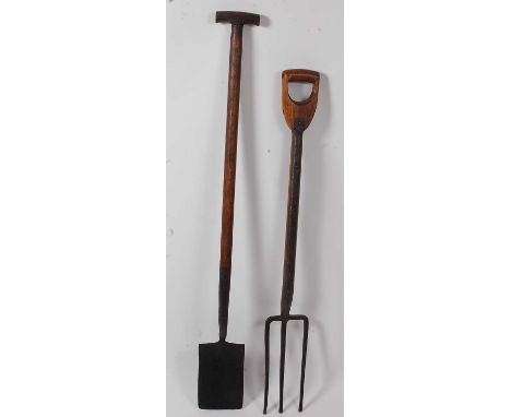 * An early 20th century rabbiting spade, having a typical rectangular blade and ash shaft with T handle, 128cm, together with