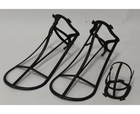 * A pair of iron saddle racks, each with tack hook, 52cm; together with a tack harness rack (3)Condition report: From ‘A Broa