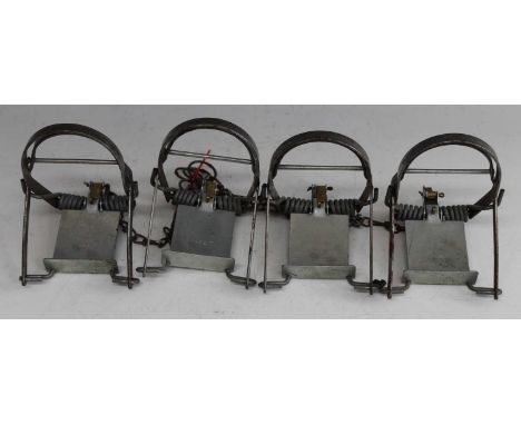 * A collection of four Fenn Mk I rabbit traps, each stamped to the plate and further stamped Fenn patent No.763881 to the bra
