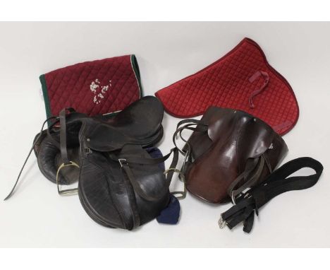* A black leather saddle with quilted numnah; together with a brown leather example with numnah (4)Condition report: From ‘A 