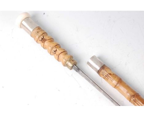 A late 19th century French bamboo sword stick, the 69cm square section blade marked Made in France, 89cm.