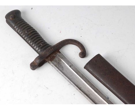 A French Model 1866 chassepot bayonet, the 57cm single edged fullered Yataghan shaped blade engraved to the back edge Mre Imp