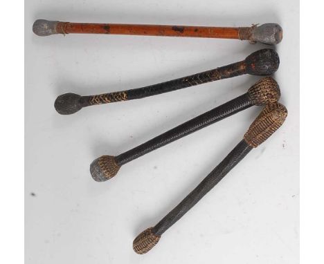 * An early 20th century double ended hunting priest, having strung weighted ends and plaited shaft, 29cm, together with three