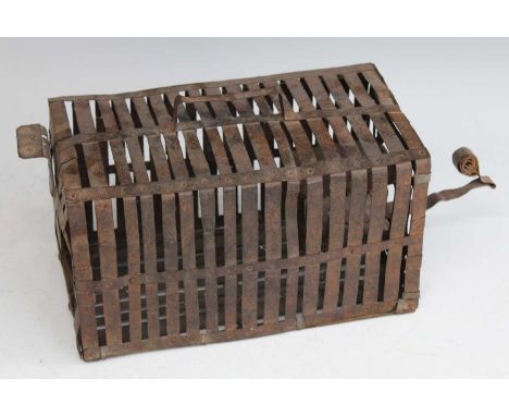 * An early 20th century mouse / rat cage, of slatted tin construction, circa 1930, w.39cmCondition report: From ‘A Broad Coll