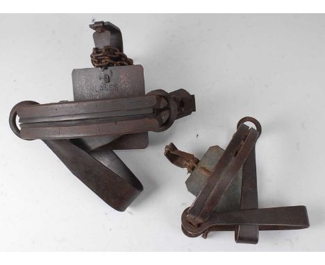 * An early 20th century Lane's Dog Trap, having 7" rubber mounted jaws stamped Made in W.A. by Stockbrands Co, together with 