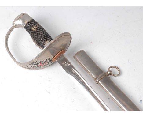 A reproduction Spanish sword, having a 78cm blade stamped Toledo Spain, the steel hilt with Imperial eagle, housed in a steel