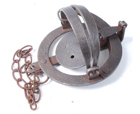 * A Victorian pole trap, having 4" smooth round jaws and steel tongue, the spring neck stamped H. Lane.Condition report: From