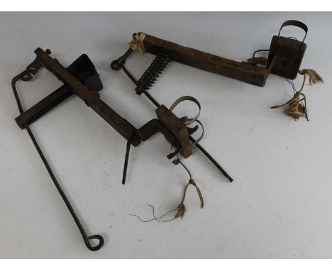 * A near-pair of late 19th / early 20th century rustic board-top style mole traps, 38cm (2)Condition report: From ‘A Broad Co