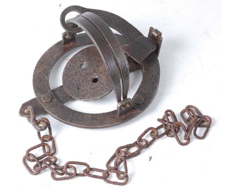 * An early 20th century steel pole trap, having 4" smooth jaws, unmarked.Condition report: From ‘A Broad Collection from a li