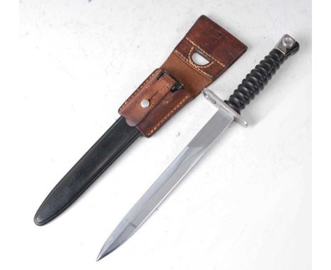 * A Swiss M1957 S.I.G. bayonet, the 24cm double edged blade marked to the ricasso F over +W for Waffenfabrik Bern and V 12041