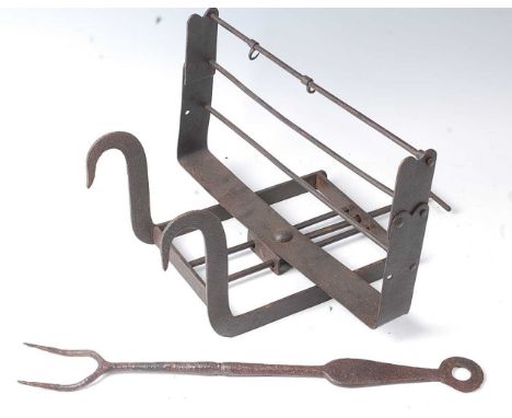 * An 18th century wrought iron lark spit, having an adjustable rotating grill for three birds, 44cm, together with an 18th ce