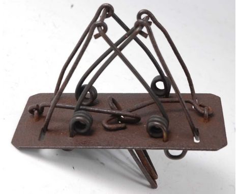 * An early 20th century iron double loop mole trap, possibly C. Homes, 12cm.Condition report: From ‘A Broad Collection from a