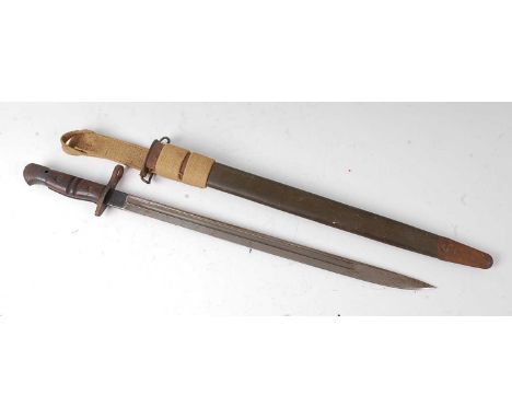A Remington M1917 bayonet, the 43cm singled edged fullered blade marked to the ricasso 1917 Remington with an eagle and flami