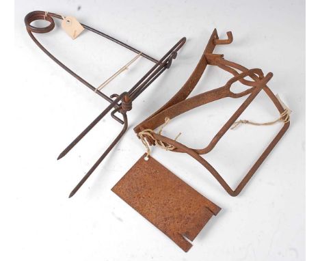 * An Aldrich type I foot snare, together with a Rohrenfalle rabbit pipe trap. (2)An example of the Rohrenfalle trap can be se
