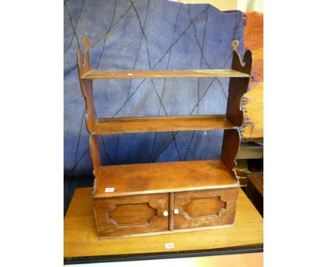 Georgian Walnut hanging shelf unit with cupboard base and porcelain handles, 59cm in Diameter