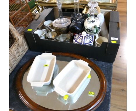 Oval wooden framed mirror, two Le Creuset ceramic dishes and box of decanters, mugs, dog figure, plated teaware etc