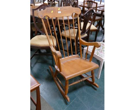 Light wood spindle back rocking chair