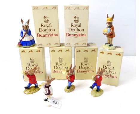 Six Royal Doulton Bunnykins figures, four playing trumpets and Mr &amp; Mrs Bunnykins