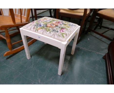 White footstool with floral tapestry top