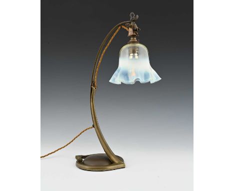 W A S Benson, an Arts and Crafts brass table lamp, model 1079, circa 1900, strap arched arm on a foliate shield form base, wi