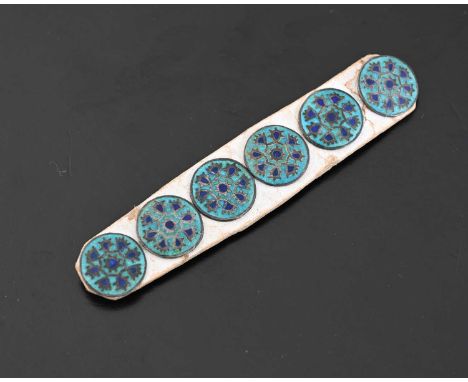 A set of six Arts and Crafts enamelled buttons, cloisonne enamel in turquoise and blue, of floral wreath design in the Persia