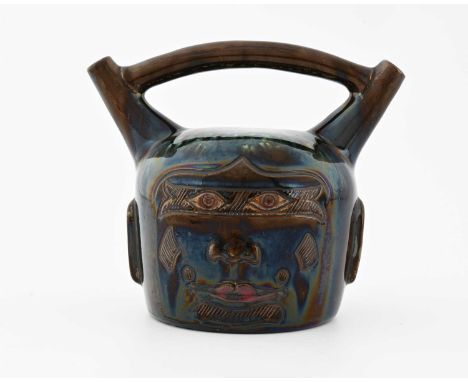 Christopher Dresser for Linthorpe, an art pottery Peruvian pouring vessel, circa 1880, modelled after a pre Columbian face ju
