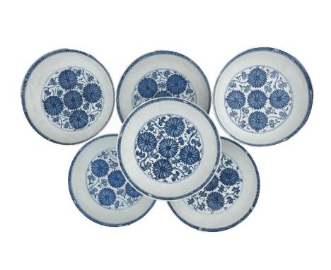 A set of six Chinese blue and white dishes, Qing Dynasty, decorated in underglaze blue with chrysanthemums on a foliate scrol
