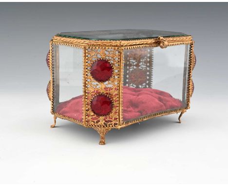 A French Palais Royal gilt metal and glass panelled jewel casket, mid 19th century, canted cuboid form, the reticulated folia
