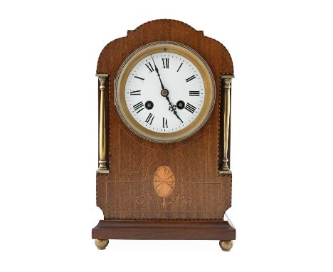 An Edwardian mahogany bracket clock, circa 1910, barbers pole strung arched case with patera inlay, 9.5cm white enamel convex