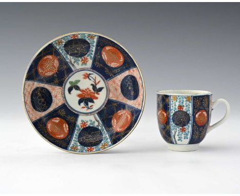 A Worcester polychrome coffee cup and saucer, circa 1770, decorated with a version of the Old Mosaic Japanese pattern, with M