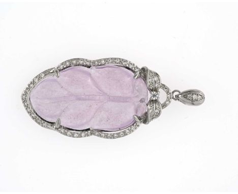 A Chinese lavender jade and white stone pendant, mounted in silver coloured metal, carved leaf form, suspended on a link, 7cm
