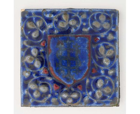 Pilkington and Co., a Royal Lancastrian heraldic lustre tile, circa 1915, relief moulded with a central shield and Holy monog