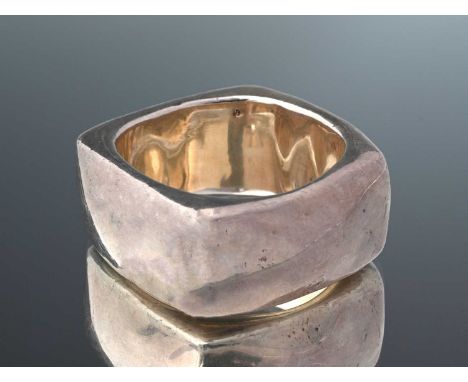 A silver square bangle bracelet, silver hallmark rubbed, inner diameter 6.3cm, width 3.5cm, 112.9gProvenance: Lesley Craze Ga