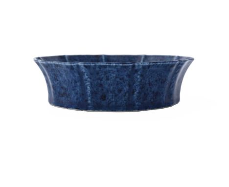 A Chinese powder blue dish, Xuande mark, moulded ogee lotus lappet form, underglaze sgraffito scroll or dragon design, six ch