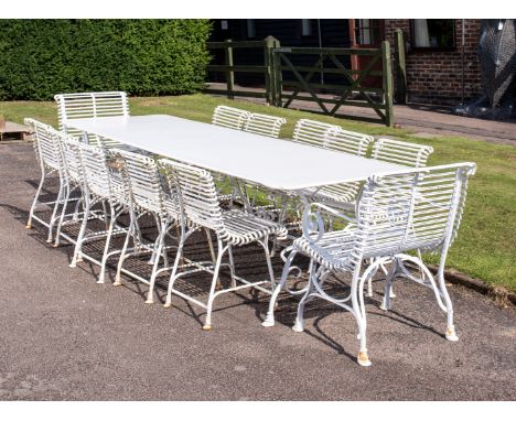 An impressive suite of iron Arras furniturerecent comprising of table and 12 chairs (2 of which are carvers) table is 298cm b