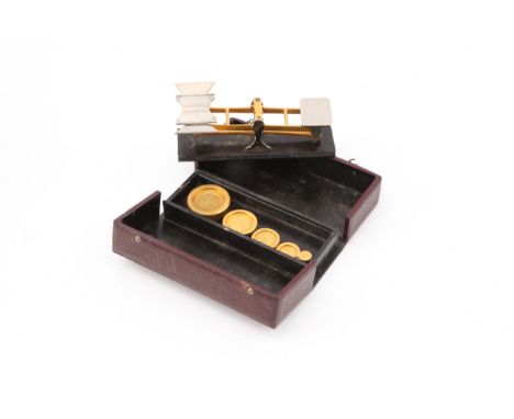 A Good Quality Set of Pocket Scales,  a balance  in gilt brass and chrome, on Morocco leather covered base, in fitted Morocco