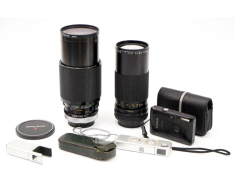 A Canon Digital IXUS 100 IS Camera, together with a Minox B and two telephoto lenses, Canon includes a 4GB SD card (a lot)