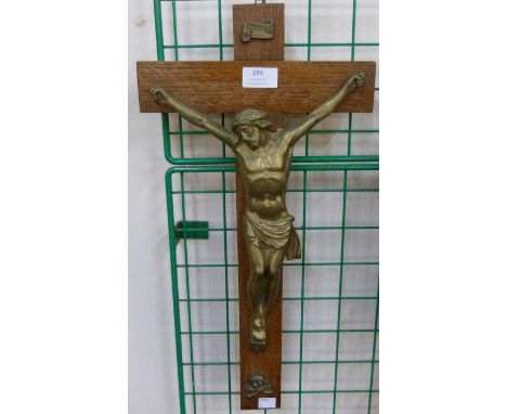 A French oak and brass wall hanging crucifix 