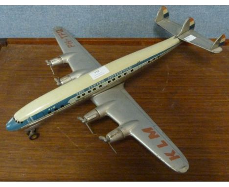 A post-war model tin plate toy KLM 'Flying Dutchman' Lockheed Constellation aeroplane by Arnold of West Germany. Friction dri